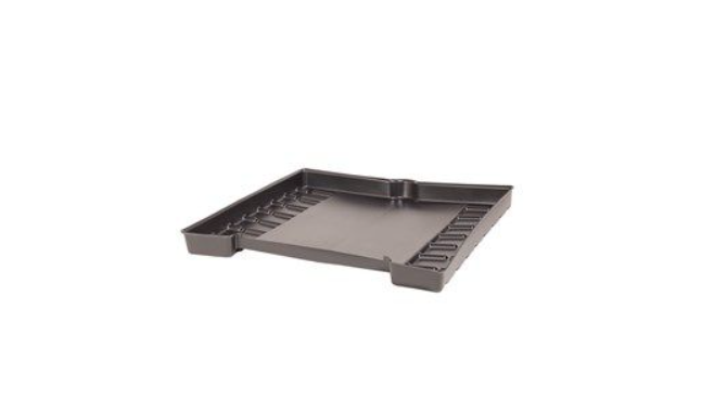 The containment tray seen from a low angle, showing the raised peripheral lip and shallow profile