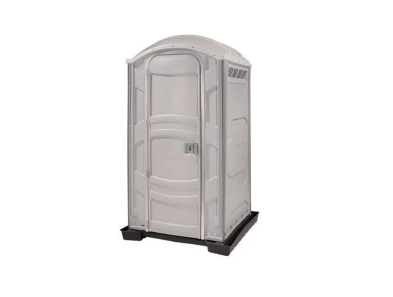 A portable restroom standing inside the containment tray